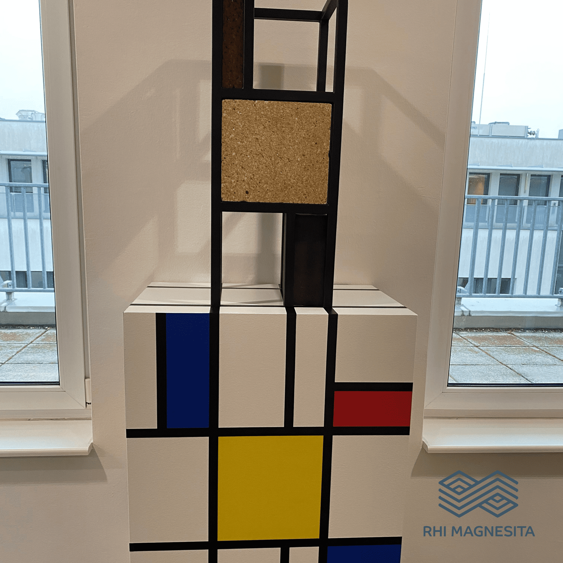 Colored mosaic on a white box, shown in the context of the CANCOM smART Walk.